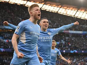 Manchester City's Belgian midfielder Kevin De Bruyne celebrates after scoring a goal during the UEFA Champions League semi-final first leg football match between Manchester City and Real Madrid, at the Etihad Stadium, in Manchester, on April 26, 2022. (Photo by Paul ELLIS / AFP) Manchester City's Belgian midfielder Kevin De Bruyne celebrates after scoring a goal during the UEFA Champions League semi-final first leg football match between Manchester City and Real Madrid, at the Etihad Stadium, in Manchester, on April 26, 2022. (Photo by Paul ELLIS / AFP)