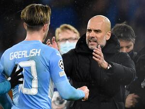 Manchester City's Spanish manager Pep Guardiola (R) speaks with Manchester City's English midfielder Jack Grealish on the pitch after the UEFA Champions League Quarter-final first leg football match between Manchester City and Atletico Madrid at the Etihad Stadium in Manchester, north west England, on April 5, 2022. Manchester City won the game 1-0. (Photo by Oli SCARFF / AFP) Manchester City's Spanish manager Pep Guardiola (R) speaks with Manchester City's English midfielder Jack Grealish on the pitch after the UEFA Champions League Quarter-final first leg football match between Manchester City and Atletico Madrid at the Etihad Stadium in Manchester, north west England, on April 5, 2022. Manchester City won the game 1-0. (Photo by Oli SCARFF / AFP)