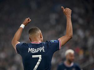 Paris Saint-Germain's French forward Kylian Mbappe celebrates after scoring a third goal during the French L1 football match between Paris Saint-Germain (PSG) and Metz at the Parc des Princes stadium in Paris on May 21, 2022. (Photo by Anne-Christine POUJOULAT / AFP)  Paris Saint-Germain's French forward Kylian Mbappe celebrates after scoring a third goal during the French L1 football match between Paris Saint-Germain (PSG) and Metz at the Parc des Princes stadium in Paris on May 21, 2022. (Photo by Anne-Christine POUJOULAT / AFP)