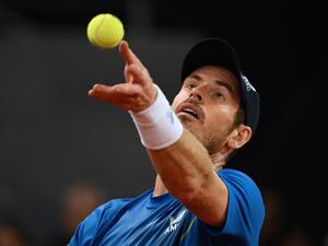 Great Britain's Andy Murray serves to Austria's Dominic Thiem during their 2022 ATP Tour Madrid Open tennis tournament singles match at the Caja Magica in Madrid on May 2, 2022. (Photo by GABRIEL BOUYS / AFP) Great Britain's Andy Murray serves to Austria's Dominic Thiem during their 2022 ATP Tour Madrid Open tennis tournament singles match at the Caja Magica in Madrid on May 2, 2022. (Photo by GABRIEL BOUYS / AFP)
