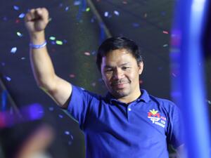 This photo taken on May 7, 2022 shows Philippine boxing icon and presidential candidate Manny Pacquiao raising a clinched fist during a campaign rally in General Santos City, on the southern island of Mindanao. (Photo by AFP) This photo taken on May 7, 2022 shows Philippine boxing icon and presidential candidate Manny Pacquiao raising a clinched fist during a campaign rally in General Santos City, on the southern island of Mindanao. (Photo by AFP)