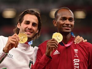 Joint gold medalists Qatar's Mutaz Essa Barshim (R) and Italy's Gianmarco Tamberi pose on the podiumn of the men's high jump final during the Tokyo 2020 Olympic Games at the Olympic Stadium in Tokyo on August 2, 2021. (Photo by Ina FASSBENDER / AFP) Joint gold medalists Qatar's Mutaz Essa Barshim (R) and Italy's Gianmarco Tamberi pose on the podiumn of the men's high jump final during the Tokyo 2020 Olympic Games at the Olympic Stadium in Tokyo on August 2, 2021. (Photo by Ina FASSBENDER / AFP)