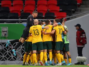 Australia's players celebrate after scoring a goal during the FIFA World Cup 2022 play-off qualifier football match between UAE and Australia at Ahmad bin Ali stadium in Qatar's Ar-Rayyan on June 7, 2022. (Photo by KARIM JAAFAR / AFP) Australia's players celebrate after scoring a goal during the FIFA World Cup 2022 play-off qualifier football match between UAE and Australia at Ahmad bin Ali stadium in Qatar's Ar-Rayyan on June 7, 2022. (Photo by KARIM JAAFAR / AFP)