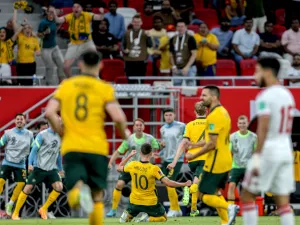 Australia's midfielder Ajdin Hrustic (C) celebrates after scoring his team's second goal during the FIFA World Cup 2022 play-off qualifier football match between UAE and Australia at Ahmad bin Ali stadium in Qatar's Ar-Rayyan city on June 7, 2022. (Photo by Mustafa ABUMUNES / AFP)