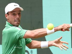 Spain's Roberto Bautista Agut returns the ball to Russia's Daniil Medvedev reacts (not pictured) during the men's singles quarter final match at the ATP 500 Halle Open tennis tournament in Halle, western Germany, on June 17, 2022. (Photo by CARMEN JASPERSEN / AFP) Spain's Roberto Bautista Agut returns the ball to Russia's Daniil Medvedev reacts (not pictured) during the men's singles quarter final match at the ATP 500 Halle Open tennis tournament in Halle, western Germany, on June 17, 2022. (Photo by CARMEN JASPERSEN / AFP)