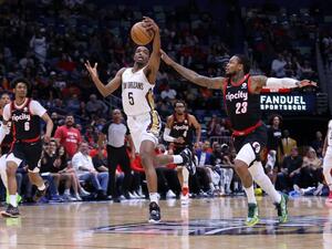 Herbert Jones #5 of the New Orleans Pelicans steals the ball from Ben McLemore #23 of the Portland Trail Blazers during the first half at the Smoothie King Center on April 07, 2022 in New Orleans, Louisiana.  (Photo by Jonathan Bachman / GETTY IMAGES NORTH AMERICA / Getty Images via AFP) Herbert Jones #5 of the New Orleans Pelicans steals the ball from Ben McLemore #23 of the Portland Trail Blazers during the first half at the Smoothie King Center on April 07, 2022 in New Orleans, Louisiana.  (Photo by Jonathan Bachman / GETTY IMAGES NORTH AMERICA / Getty Images via AFP)