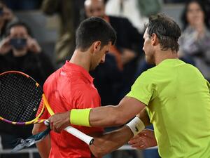 Spain's Rafael Nadal (R) shakes hands with Serbia's Novak Djokovic (L) after winning at the end of their men's singles match on day ten of the Roland-Garros Open tennis tournament at the Court Philippe-Chatrier in Paris early June 1, 2022. (Photo by Anne-Christine POUJOULAT / AFP) Spain's Rafael Nadal (R) shakes hands with Serbia's Novak Djokovic (L) after winning at the end of their men's singles match on day ten of the Roland-Garros Open tennis tournament at the Court Philippe-Chatrier in Paris early June 1, 2022. (Photo by Anne-Christine POUJOULAT / AFP)