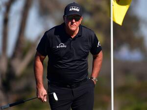 Phil Mickelson lines up his putt on the 10th hole green during the second round of The Farmers Insurance Open on the North Course at Torrey Pines Golf Course on January 27, 2022 in La Jolla, California. Donald Miralle/Getty Images/AFP (Photo by DONALD MIRALLE / GETTY IMAGES NORTH AMERICA / Getty Images via AFP) Phil Mickelson lines up his putt on the 10th hole green during the second round of The Farmers Insurance Open on the North Course at Torrey Pines Golf Course on January 27, 2022 in La Jolla, California. Donald Miralle/Getty Images/AFP (Photo by DONALD MIRALLE / GETTY IMAGES NORTH AMERICA / Getty Images via AFP)
