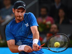 Great Britain's Andy Murray returns the ball to Austria's Dominic Thiem during their 2022 ATP Tour Madrid Open tennis tournament singles match at the Caja Magica in Madrid on May 2, 2022. (Photo by GABRIEL BOUYS / AFP) Great Britain's Andy Murray returns the ball to Austria's Dominic Thiem during their 2022 ATP Tour Madrid Open tennis tournament singles match at the Caja Magica in Madrid on May 2, 2022. (Photo by GABRIEL BOUYS / AFP)