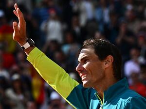 Spain's Rafael Nadal waves as he celebrates after victory over Norway's Casper Ruud during their men's singles final match on day fifteen of the Roland-Garros Open tennis tournament at the Court Philippe-Chatrier in Paris on June 5, 2022. (Photo by Anne-Christine POUJOULAT / AFP) Spain's Rafael Nadal waves as he celebrates after victory over Norway's Casper Ruud during their men's singles final match on day fifteen of the Roland-Garros Open tennis tournament at the Court Philippe-Chatrier in Paris on June 5, 2022. (Photo by Anne-Christine POUJOULAT / AFP)