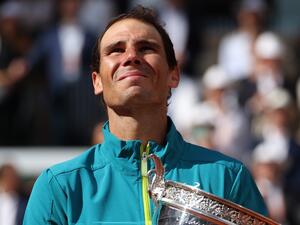 Spain's Rafael Nadal poses with The Musketeers' Cup as he celebrates after victory over Norway's Casper Ruud during their men's singles final match on day fifteen of the Roland-Garros Open tennis tournament at the Court Philippe-Chatrier in Paris on June 5, 2022. (Photo by Thomas SAMSON / AFP) Spain's Rafael Nadal poses with The Musketeers' Cup as he celebrates after victory over Norway's Casper Ruud during their men's singles final match on day fifteen of the Roland-Garros Open tennis tournament at the Court Philippe-Chatrier in Paris on June 5, 2022. (Photo by Thomas SAMSON / AFP)