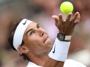 Spain's Rafael Nadal serves to Canada's Felix Auger-Aliassime during their men's exhibition singles match at The Giorgio Armani Tennis Classic tournament at the Hurlingham Club in London on June 24, 2022. (Photo by Adrian DENNIS / AFP) Spain's Rafael Nadal serves to Canada's Felix Auger-Aliassime during their men's exhibition singles match at The Giorgio Armani Tennis Classic tournament at the Hurlingham Club in London on June 24, 2022. (Photo by Adrian DENNIS / AFP)