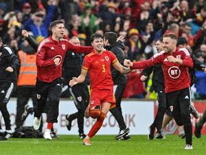 Wales' defender Neco Williams (C) celebrates with teammates after winning the FIFA World Cup 2022 play-off final qualifier football match between Wales and Ukraine at the Cardiff City Stadium in Cardiff, south Wales, on June 5, 2022. (Photo by Paul ELLIS / AFP) Wales' defender Neco Williams (C) celebrates with teammates after winning the FIFA World Cup 2022 play-off final qualifier football match between Wales and Ukraine at the Cardiff City Stadium in Cardiff, south Wales, on June 5, 2022. (Photo by Paul ELLIS / AFP)