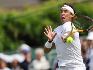 Spain's Rafael Nadal returns to Canada's Felix Auger-Aliassime during their men's exhibition singles match at The Giorgio Armani Tennis Classic tournament at the Hurlingham Club in London on June 24, 2022. (Photo by Adrian DENNIS / AFP) Spain's Rafael Nadal returns to Canada's Felix Auger-Aliassime during their men's exhibition singles match at The Giorgio Armani Tennis Classic tournament at the Hurlingham Club in London on June 24, 2022. (Photo by Adrian DENNIS / AFP)