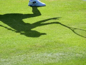 The shadow of Belgium's Elise Mertens is pictured as she returns the ball to Colombia's Camila Osorio during their women's singles tennis match on the first day of the 2022 Wimbledon Championships at The All England Tennis Club in Wimbledon, southwest London, on June 27, 2022. (Photo by SEBASTIEN BOZON / AFP)