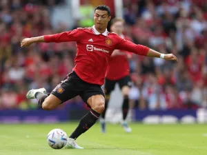 Manchester United's Portuguese striker Cristiano Ronaldo passes the ball during a pre-season club friendly football match between Manchester United and Rayo Vallecano at Old Trafford in Manchester, north west England, on July 31, 2022. (Photo by Nigel Roddis / AFP)