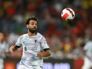 Liverpool's Egyptian forward Mohamed Salah looks towards the ball during the exhibition football match between English Premier League teams Manchester United and Liverpool FC at Rajamangala National Stadium in Bangkok on July 12, 2022. (Photo by MANAN VATSYAYANA / AFP)