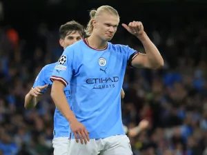 Manchester City's Norwegian striker Erling Haaland celebrates his goal during the UEFA Champions League group G football match between England's Manchester City and Germany's Borussia Dortmund at the Etihad Stadium in Manchester on September 14, 2022. (Photo by Lindsey Parnaby / AFP)