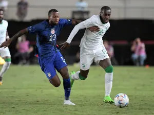 US midfielder Kellyn Acosta (L) vies with Saudi Arabia's defender Saud Abdulhamid during the friendly football match between Saudi Arabia and United States at the Nueva Condomina stadium in Murcia on September 27, 2022. (Photo by Jose Jordan / AFP)