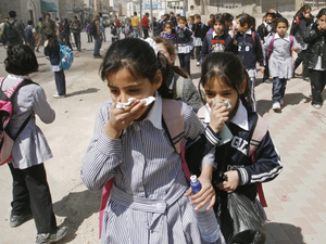 Palestinian school girls in Hebron run away from gas canisters 