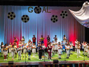 QF students present musical production inspired by world cup