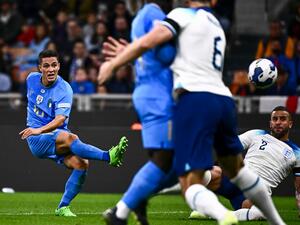 Italy's midfielder Giacomo Raspadori (L) scores a goal during the UEFA Nations League's League A Group 3 match between Italy and England, at the San Siro Stadium in Milan on September 23, 2022. (Photo by Marco BERTORELLO / AFP)