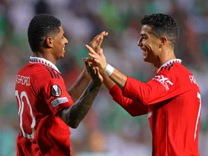 (R to L) Manchester United's Portuguese striker Cristiano Ronaldo and Manchester United's English striker Marcus Rashford celebrate together after the latter's goal during the UEFA Europa League group E football match between Cyprus' Omonia Nicosia and England's Manchester United at GSP stadium in the capital Nicosia on October 6, 2022. (Photo by AFP)