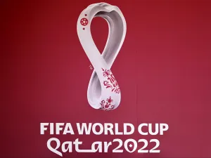 The logo of the Qatar 2022 FIFA World Cup football tournament is displayed on a wall in Doha on October 23, 2022. (Photo by Gabriel BOUYS / AFP)