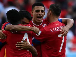 Costa Rica's players celebrate after winning the Qatar 2022 World Cup Group E football match between Japan and Costa Rica at the Ahmad Bin Ali Stadium in Al-Rayyan, west of Doha on November 27, 2022. (Photo by Philip FONG / AFP)