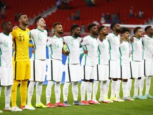 Saudi Arabia's players sing their national anthem ahead of during the FIFA Arab Cup 2021 group C football match between Morocco and Saudi Arabia at the Al-Thumama Stadium in the capital city of Doha on December 7, 2021. (Photo by Khaled DESOUKI / AFP)