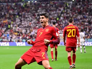 Spain's forward #07 Alvaro Morata (L) celebrates scoring his team's first goal during the Qatar 2022 World Cup Group E football match between Spain and Germany at the Al-Bayt Stadium in Al Khor, north of Doha on November 27, 2022. (Photo by JAVIER SORIANO / AFP)