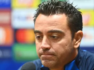 FC Barcelona's head coach Xavi looks down during a press conference in Plzen, Czech Republic, on October 31, 2022, on the eve of the UEFA Champions League Group C football match FC Viktoria Plzen v FC Barcelona. (Photo by Michal Cizek / AFP)
