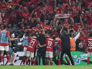 Ahly's players celebrate with the fans after winning the Egyptian Super Cup football match between Zamalek and Al-Ahly at the Hazza bin Zayed stadium in al-Ain on October 28, 2022. (Photo by Ryan LIM / AFP)