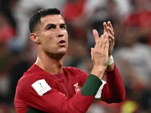 Portugal's forward #07 Cristiano Ronaldo applauds at the crowd after qualifying to the next round after defeating Switzerland 6-1 in the Qatar 2022 World Cup round of 16 football match between Portugal and Switzerland at Lusail Stadium in Lusail, north of Doha on December 6, 2022. (Photo by Anne-Christine POUJOULAT / AFP)