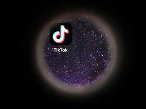 In this file photo taken on October 5, 2021 the logo of Chinese social networking service TikTok is seen on a smartphone screen. 