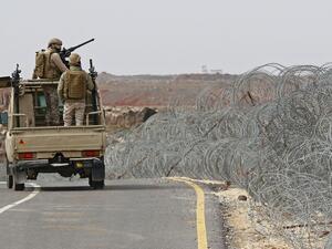 Jordanian guards patrol the Jordan-Syria border