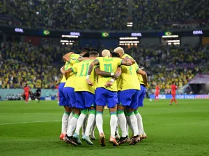 Brazil's forward #10 Neymar (C) celebrates with teammates after he scored his team's second goal from the penalty spot during the Qatar 2022 World Cup round of 16 football match between Brazil and South Korea at Stadium 974 in Doha on December 5, 2022. (Photo by MANAN VATSYAYANA / AFP)