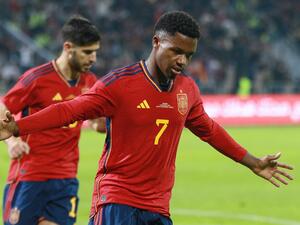 Spain's forward Ansu Fati (R) celebrates scoring during the friendly football match between Jordan and Spain, at the Hussein Youth City stadium, in the Jordanian capital Amman on November 17, 2022. (Photo by Khalil MAZRAAWI / afp / AFP)