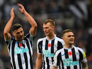 Newcastle United's Swiss defender Fabian Schar (L) celebrates after the final whistle of the English Premier League football match between Newcastle United and Chelsea at St James' Park in Newcastle-upon-Tyne, north east England on November 12, 2022. (Photo by ANDY BUCHANAN / AFP)