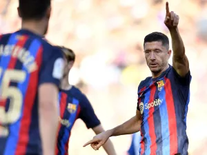 Barcelona's Polish forward Robert Lewandowski gestures during the Spanish League football match between FC Barcelona and RCD Espanyol at the Camp Nou stadium in Barcelona on December 31, 2022. (Photo by Pau BARRENA / AFP)