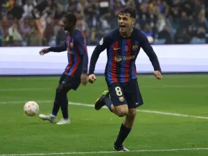 Barcelona's Spanish midfielder Pedri celebrates after scoring his team's third goal during the Spanish Super Cup final football match between Real Madrid CF and FC Barcelona at the King Fahd International Stadium in Riyadh, Saudi Arabia, on January 15, 2023. (Photo by Giuseppe CACACE / AFP)