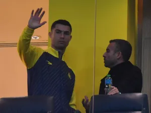 Al Nassr's Portuguese forward Cristiano Ronaldo watches from the VIP area ahead of the Saudi Pro League football match between Al-Nassr and At-Tai at the Mrsool Park Stadium in the Saudi capital Riyadh on January 6, 2023. (Photo by AFP)