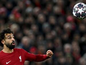 Liverpool's Egyptian striker Mohamed Salah eyes the ball during the UEFA Champions League last 16 first leg football match between Liverpool and Real Madrid at Anfield in Liverpool, north west England on February 21, 2023. (Photo by Paul ELLIS / AFP)