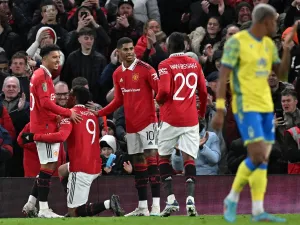 Manchester United's French striker Anthony Martial (2L) celebrates scoring the opening goal with Manchester United's English striker Jadon Sancho (L)during the English League Cup semi-final second-leg football match between Manchester United and Nottingham Forest at Old Trafford in Manchester, north west England, on February 1, 2023. (Photo by Paul ELLIS / AFP)