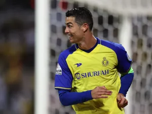 Nassr's Portuguese forward Cristiano Ronaldo celebrates scoring his team's second goal during the Saudi Pro League football match between Al-Wehda and Al-Nassr at the King Abdulaziz Stadium in Mecca on February 9, 2023. (Photo by AFP)