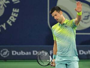 Serbia's Novak Djokovic reacts during his match with Russia's Daniil Medvedev (not pictured) at the ATP Dubai Duty Free Tennis Championship semi-final match in Dubai, on March 3, 2023. (Photo by Karim SAHIB / AFP)