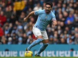 Manchester City's German midfielder Ilkay Gundogan runs with the ball during the English Premier League football match between Manchester City and Newcastle United at the Etihad Stadium in Manchester, north west England, on March 4, 2023. (Photo by Paul ELLIS / AFP)