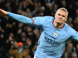 Manchester City's Norwegian striker Erling Haaland celebrates after scoring the opening goal in the English FA Cup quarter-final football match between Manchester City and Burnley at the Etihad Stadium in Manchester, north-west England, on March 18, 2023. (Photo by Oli SCARFF / AFP) 