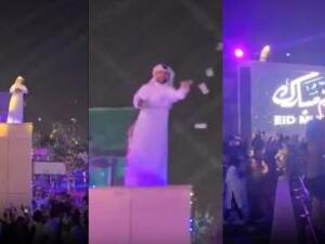 قطري يوزع المال على المارة بطريقة مهينة 