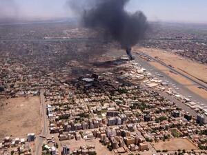 TOPSHOT - This image grab taken from AFPTV video footage on April 20, 2023, shows an aerial view of black smoke rising above the Khartoum International Airport amid ongoing battles between the forces of two rival generals. Hundreds of people have been killed since the fighting erupted on April 15 between forces loyal to Sudan's army chief Abdel Fattah al-Burhan and his deputy, Mohamed Hamdan Daglo, who commands the paramilitary Rapid Support Forces (RSF). (Photo by AFP)